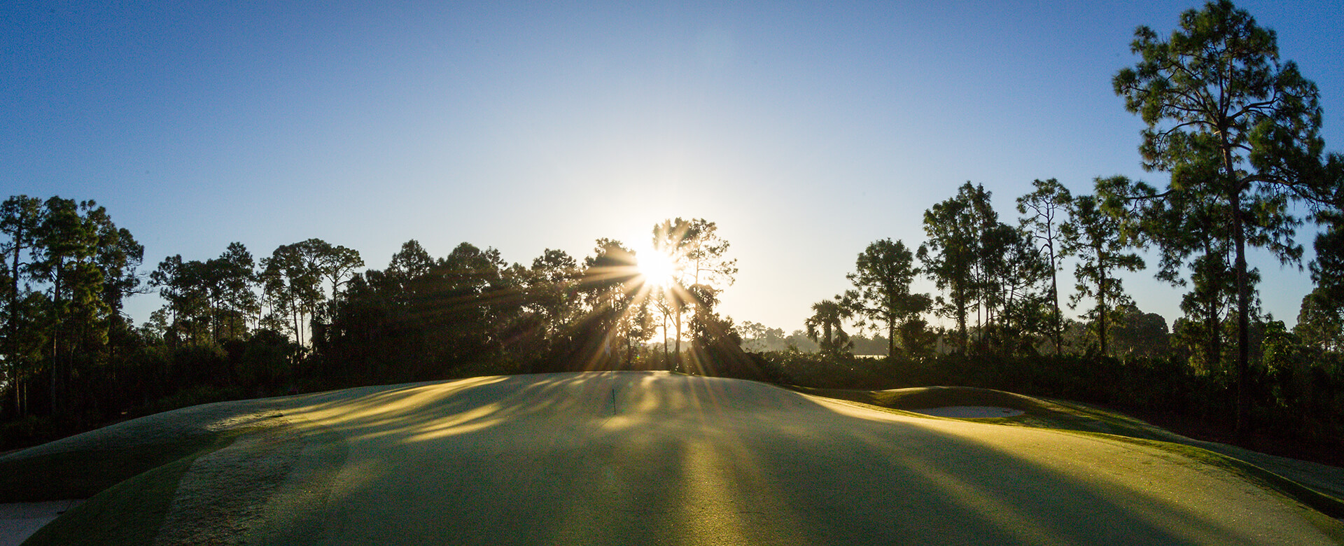 sun shining on golf course