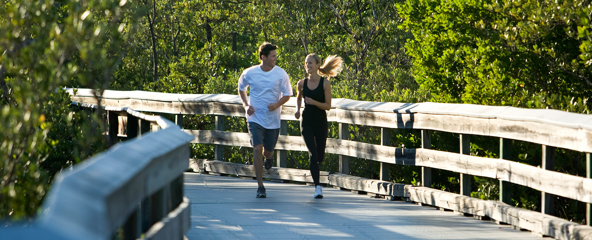 couple jogging on the boardwalk