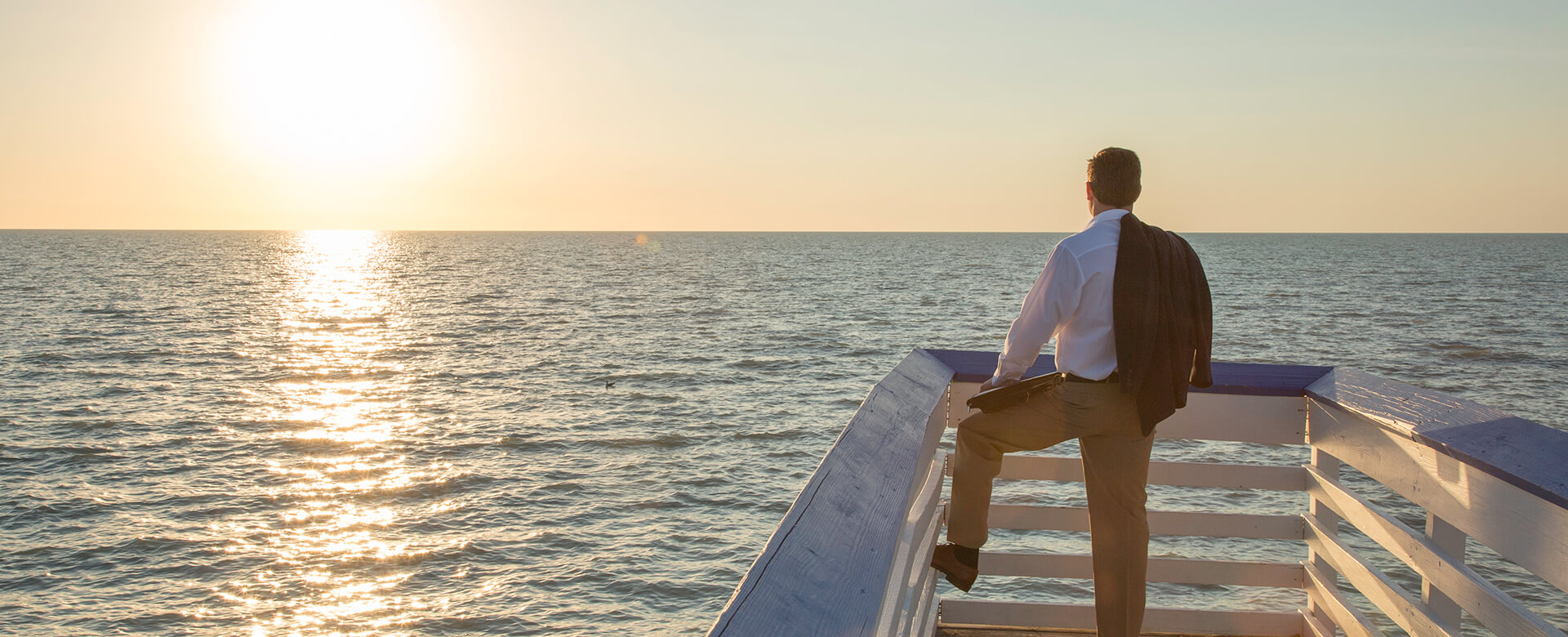 man on pier in naples